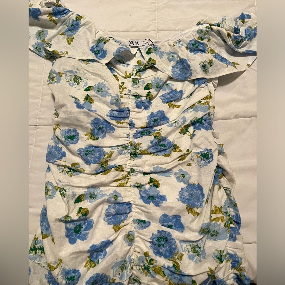 This is a Zara dress with blue hydrangeas on it. Size medium